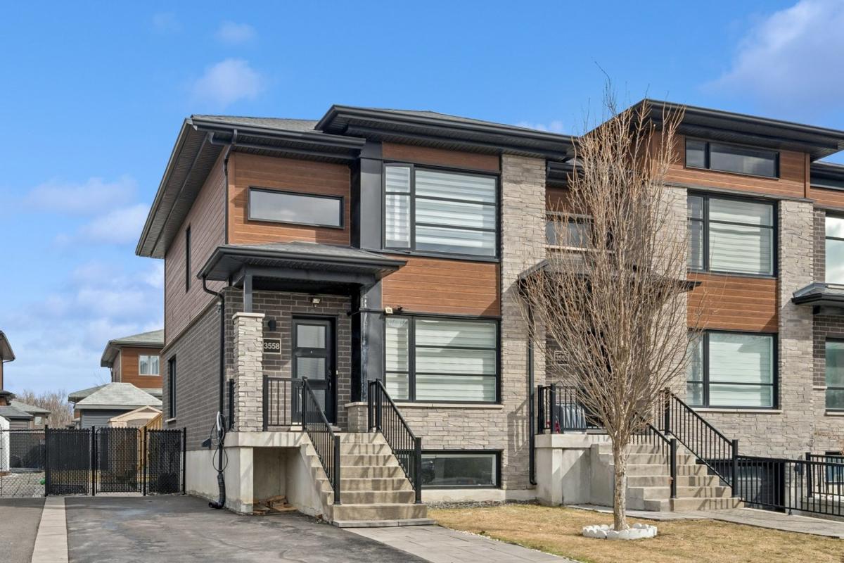 Lumineuse et moderne : une maison en rangée de coin à Longueuil, quatre chambres au cœur d'un quartier vert