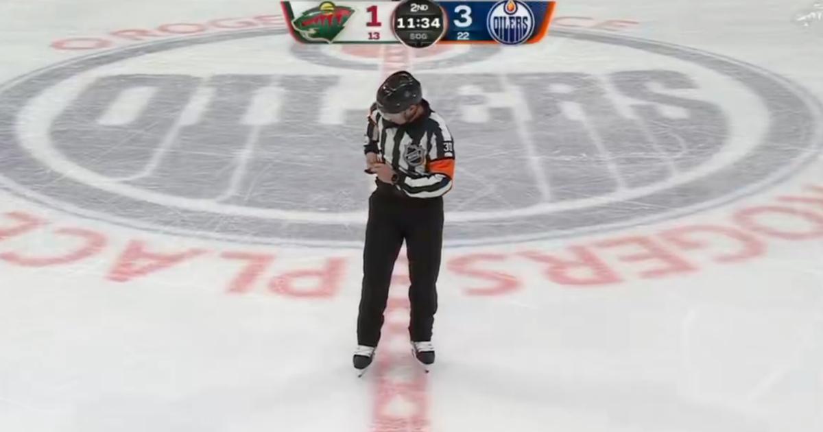 Referee at center ice 