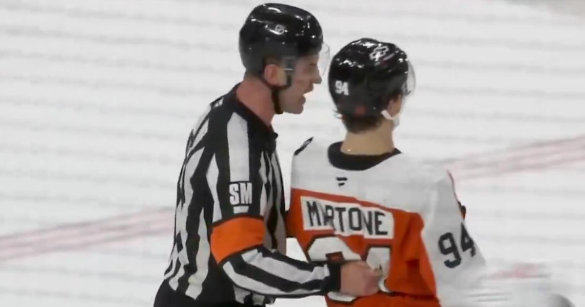 Referee Cody Beach and Porter Martone 