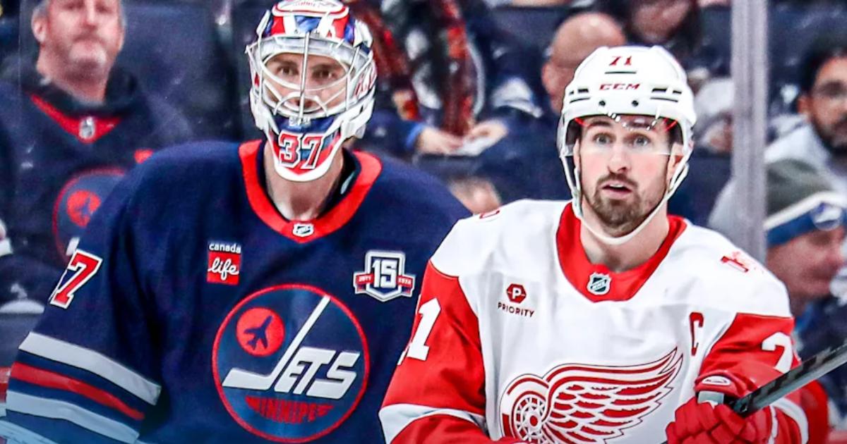 Connor Hellebuyck and Dylan Larkin