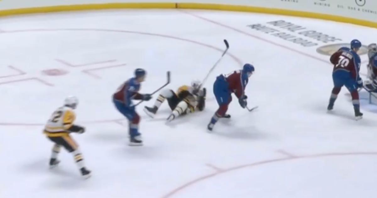 Evgeni Malkin scores while falling down. 
