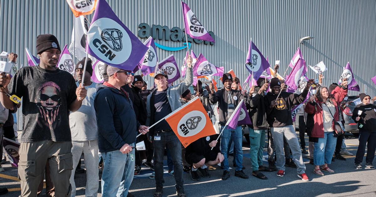 Source: CSN https://www.csn.qc.ca/, des personnes qui manifestent devant un entrepôt Amazon au Québec